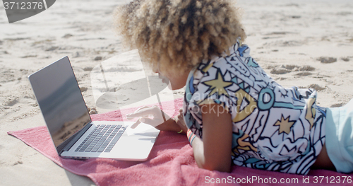 Image of Young Girl Using Computer