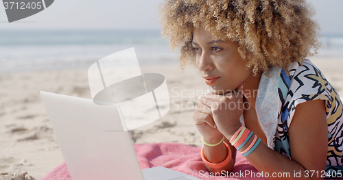 Image of Girl Working On The Sand Beach