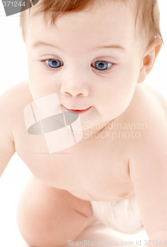 Image of portrait of crawling baby boy