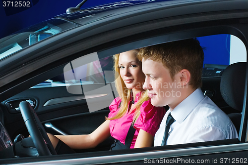 Image of Young couple sitting in car