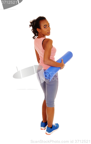 Image of Lovely african american woman with yoga mat.