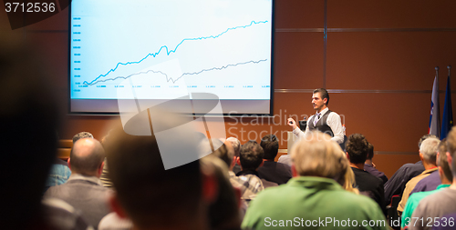 Image of Speaker at Business Conference and Presentation.