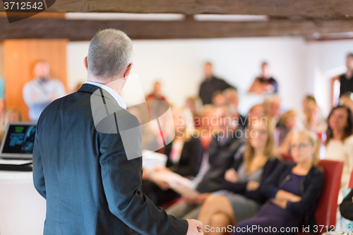 Image of Speaker at Business Conference and Presentation.