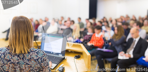 Image of Speaker at Business Conference and Presentation.