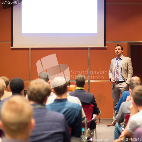 Image of Speaker Giving a Talk at Business Meeting.