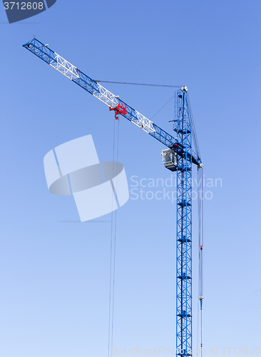 Image of Industrial landscape with silhouettes of cranes on the sky backg