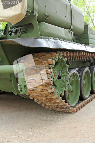 Image of Part of the undercarriage of tracked military equipment, close-up