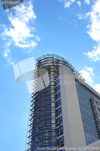 Image of Modern glass silhouettes on modern building.