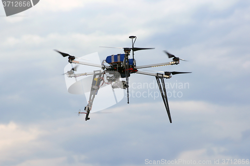 Image of Flying  drone in the sky with mounted  digital camera