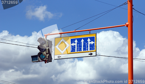 Image of Green traffic signs with the direction of travel 