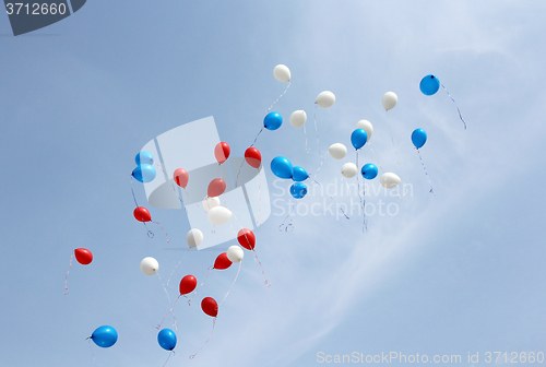 Image of colored balloons on sky