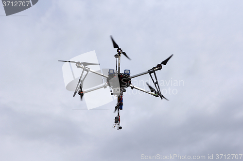 Image of Flying  drone in the sky with mounted  digital camera