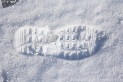 Image of foot prints in fresh snow