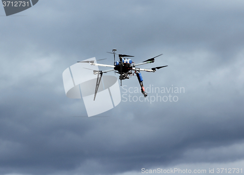 Image of Flying  drone in the sky with mounted  digital camera