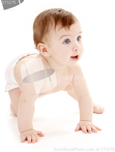 Image of crawling baby boy looking up