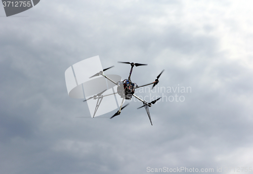 Image of Flying  drone in the sky with mounted  digital camera