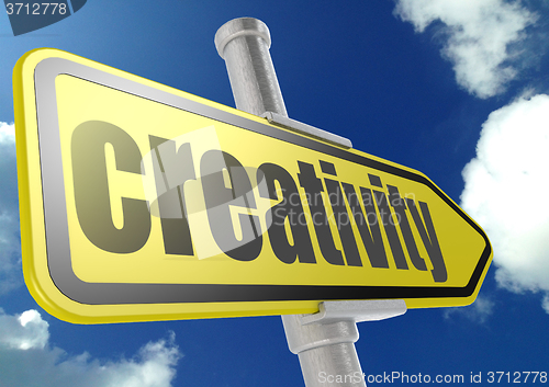 Image of Yellow road sign with creativity word under blue sky