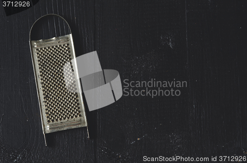 Image of aged old rustic grater