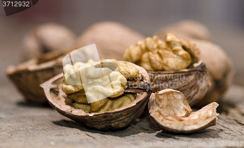 Image of Walnuts on rustic old wooden table