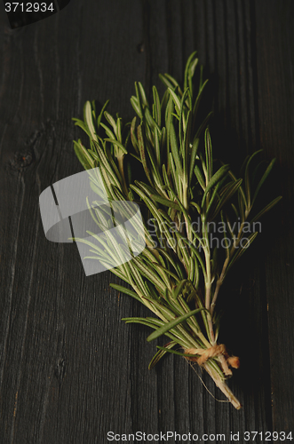 Image of Rosemary on wooden background