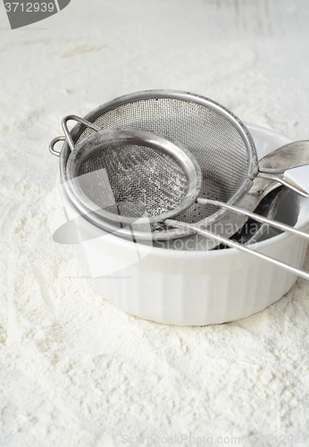 Image of Kitchen utensils and wheat flour