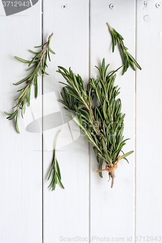Image of Rosemary on wooden background