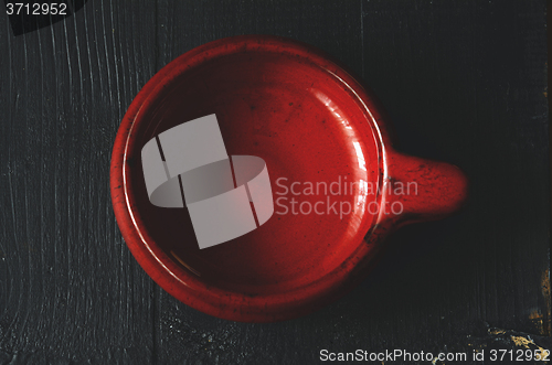 Image of Empty plate on a dark wooden table 