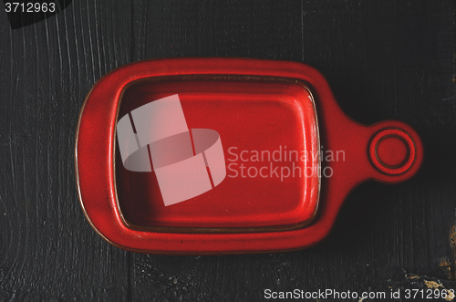 Image of Empty plate on a dark wooden table