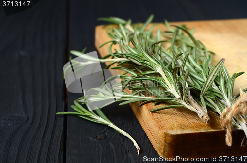 Image of Rosemary on wooden background