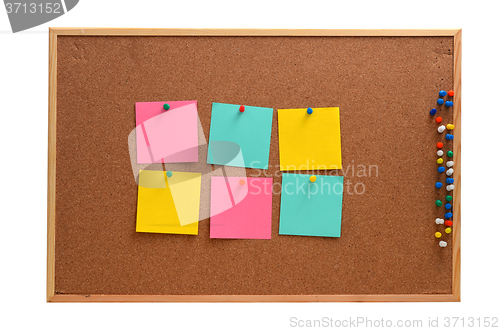 Image of Blank notes pinned into brown corkboard