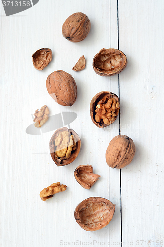 Image of Walnuts on rustic old wooden table