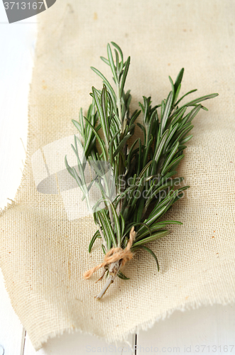 Image of Rosemary on wooden background