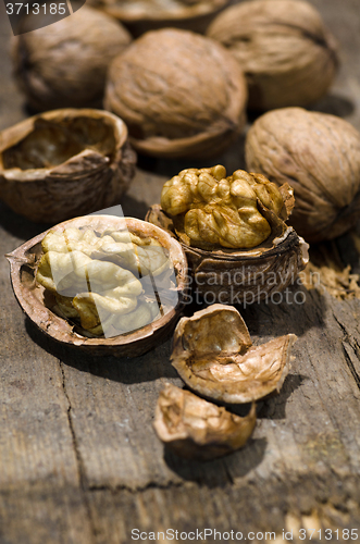 Image of Walnuts on rustic old wooden table