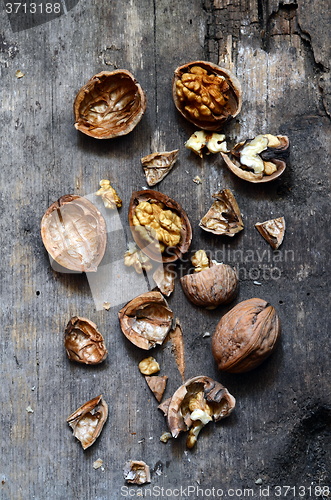 Image of Walnuts on rustic old wooden table