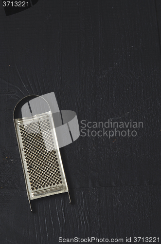 Image of aged old rustic grater