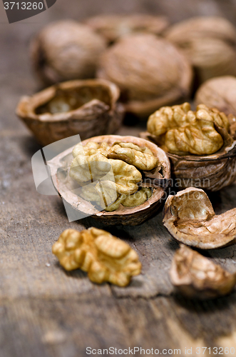 Image of Walnuts on rustic old wooden table