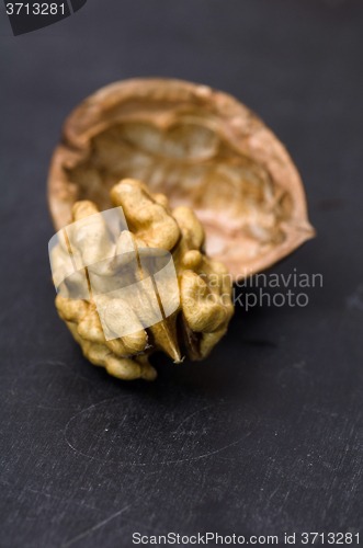 Image of Walnuts on rustic old wooden table