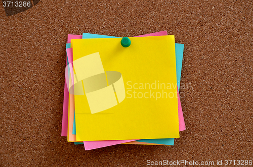 Image of Blank notes pinned into brown corkboard