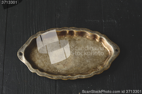 Image of Empty plate on a dark wooden table