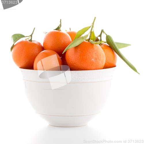 Image of Tangerines on ceramic white bowl 