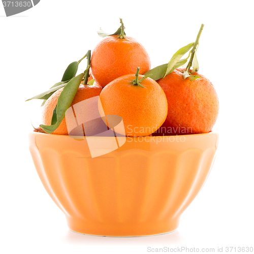 Image of Tangerines on ceramic orange bowl 