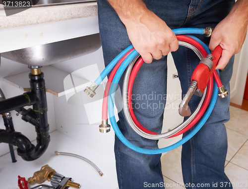 Image of Plumber on the kitchen.