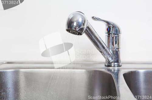 Image of Kitchen Water tap and sink.