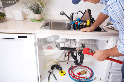 Image of Plumber on the kitchen.