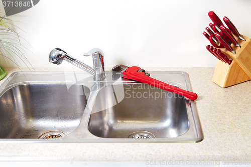 Image of Kitchen Water tap and sink.