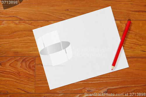 Image of Red pencil and paper