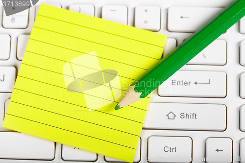 Image of Green pensil and keyboard