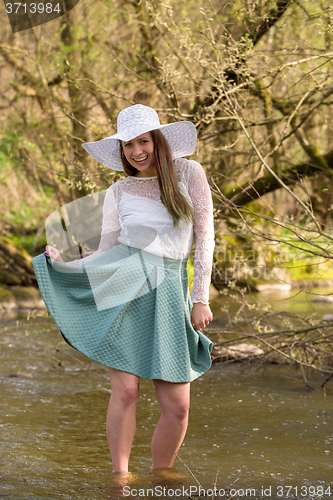 Image of woman in spring creek