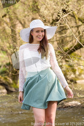 Image of woman in spring creek