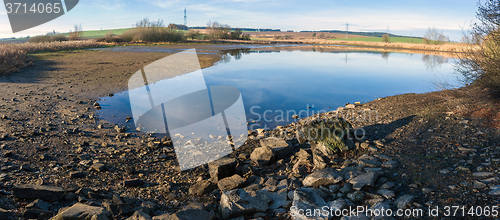 Image of drained pond in winter